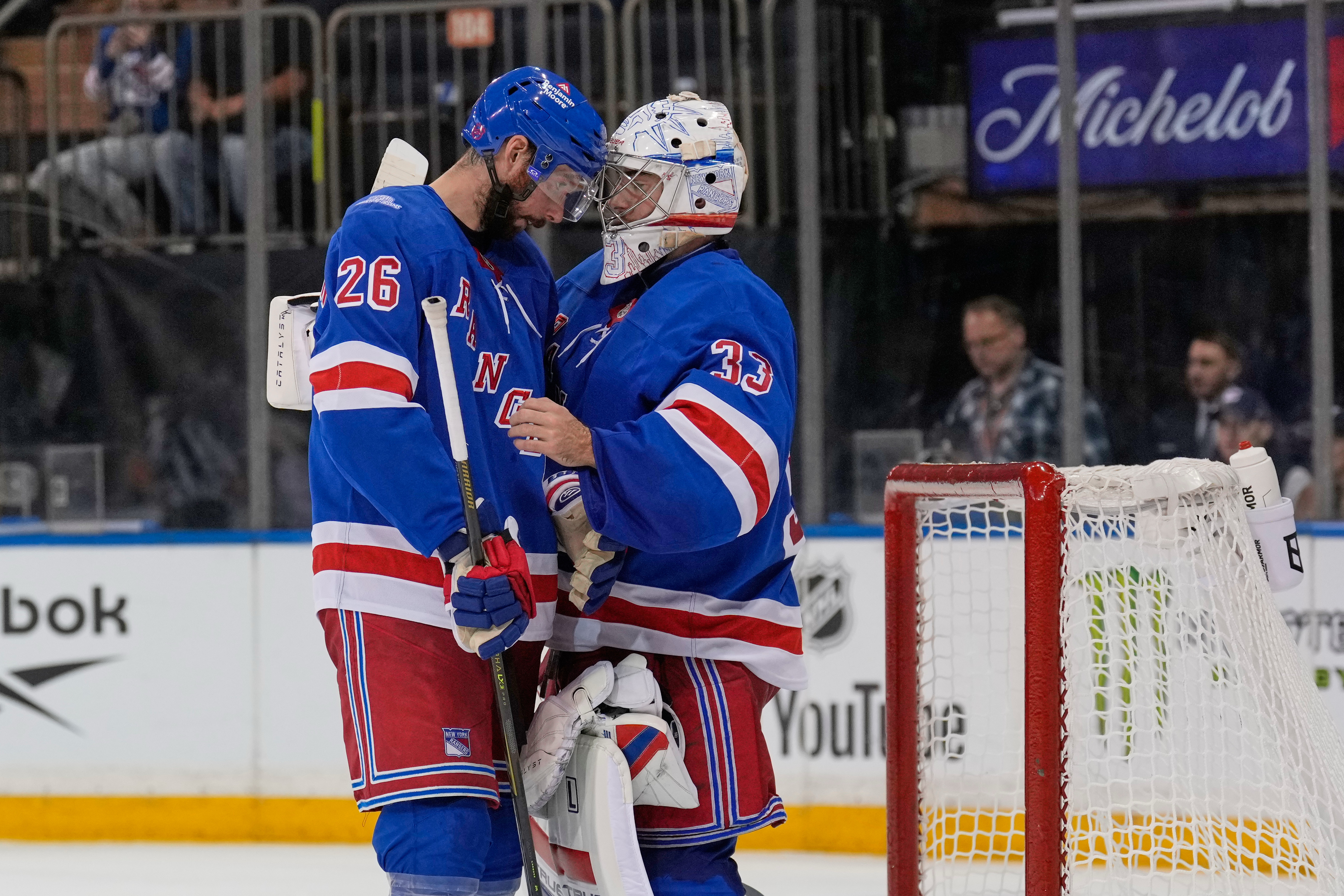 New York Rangers goaltender Dylan Garand, right, celebrates with Marcus Pettersson (26) after an NHL hockey game against the Tampa Bay Lightning in New York, Tuesday, Oct. 13, 2026. 
