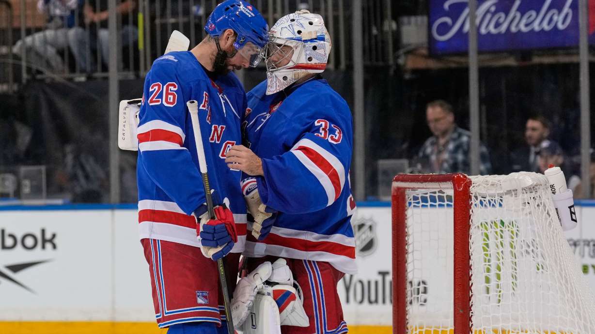 New York Rangers goaltender Dylan Garand, right, celebrates with Marcus Pettersson (26) after an NHL hockey game against the Tampa Bay Lightning in New York, Tuesday, Oct. 13, 2026.
