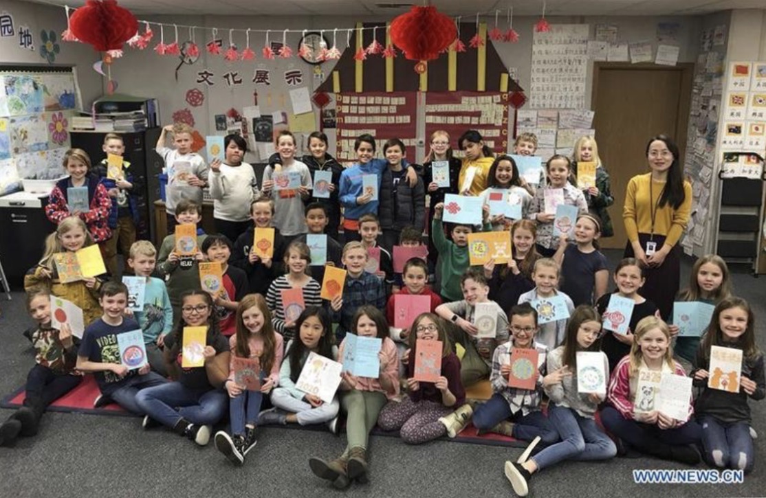 Fourth-grade students at Cascade Elementary in Orem hold up letters they wrote for Chinese New Year to send to President Xi Jinping in 2020.