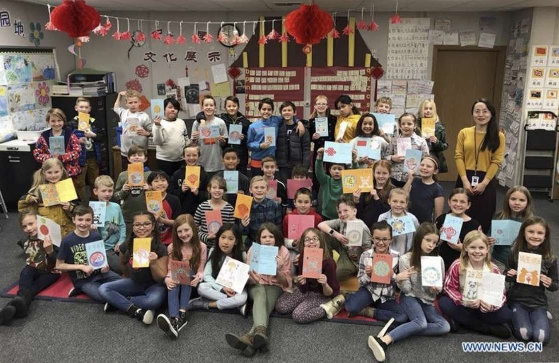 Fourth-grade students at Cascade Elementary in Orem hold up letters they wrote for Chinese New Year to send to President Xi Jinping in 2020.