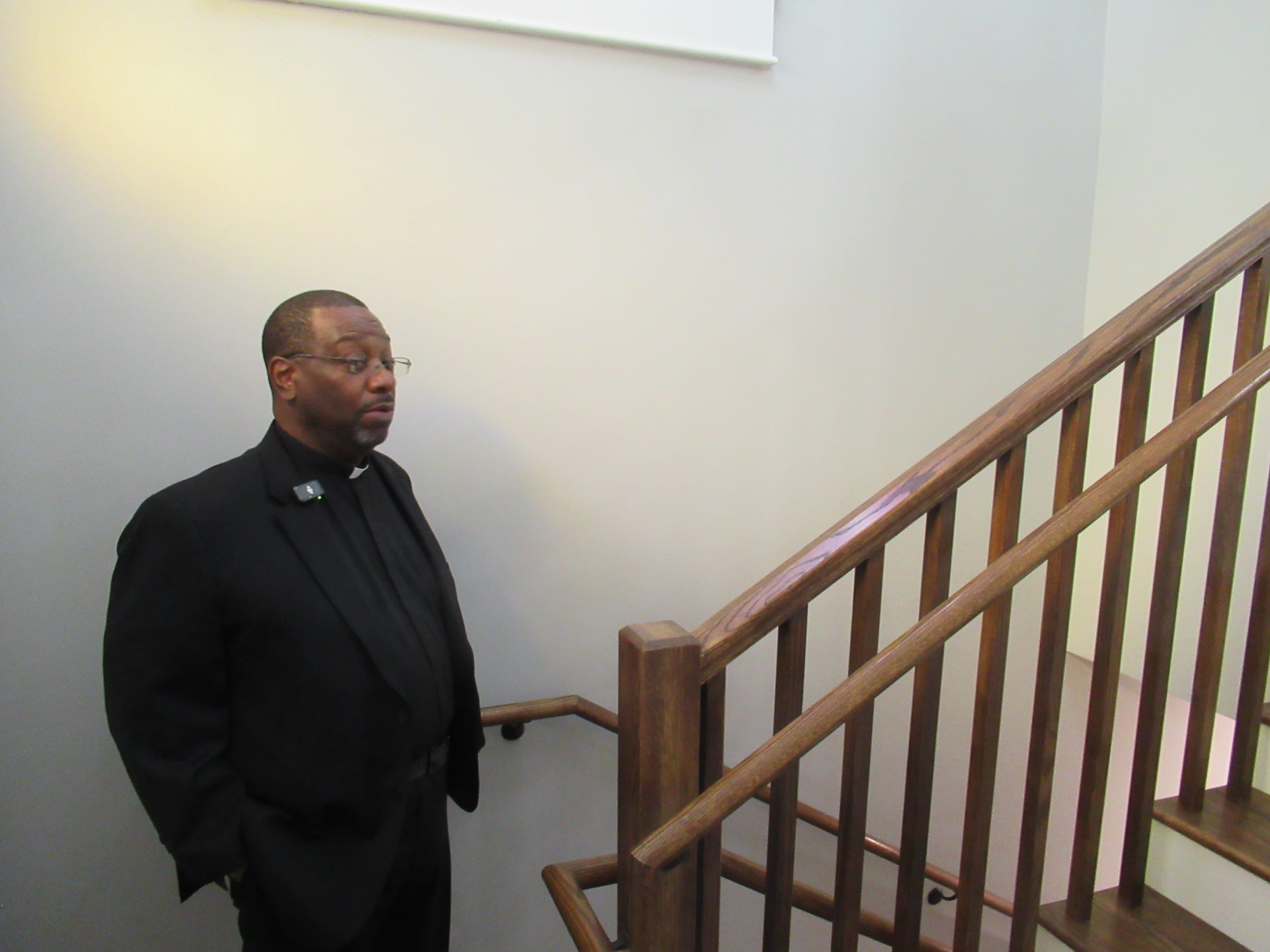 Pastor Daryell Jackson stands at the entrance of the Trinity African Methodist Episcopal Church on Oct. 14.