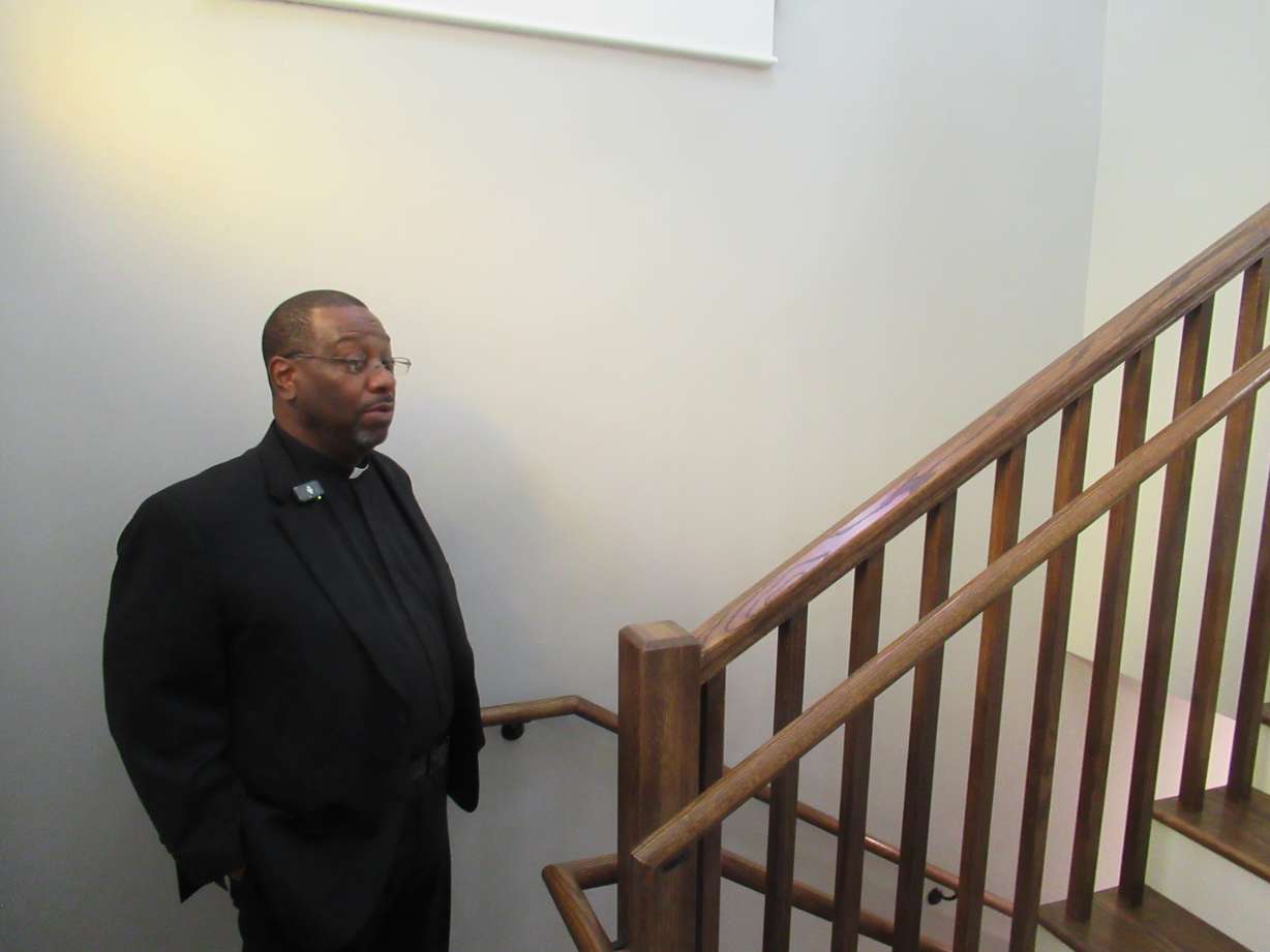Pastor Daryell Jackson stands at the entrance of the Trinity African Methodist Episcopal Church on Oct. 14.