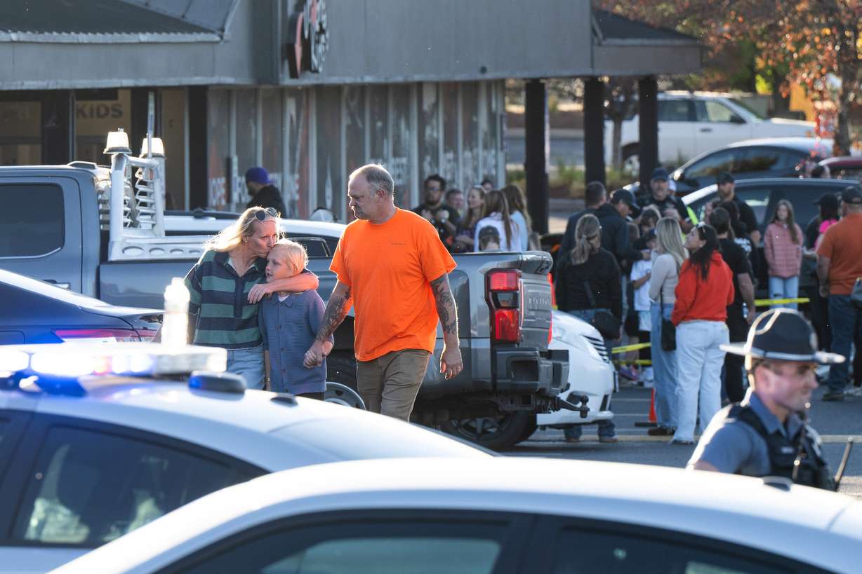 People leave a family meeting area following a shooting at Silver Rail Elementary School, Thursday, in Bend, Ore. Four people were killed, including the shooter.