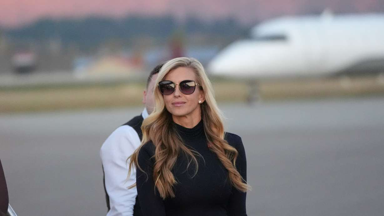White House press secretary Katie Zacharia arrives with President Donald Trump at Glacier Park International Airport, Wednesday, in Kalispell, Mont. Zacharia is leaving the post after a rocky first briefing.