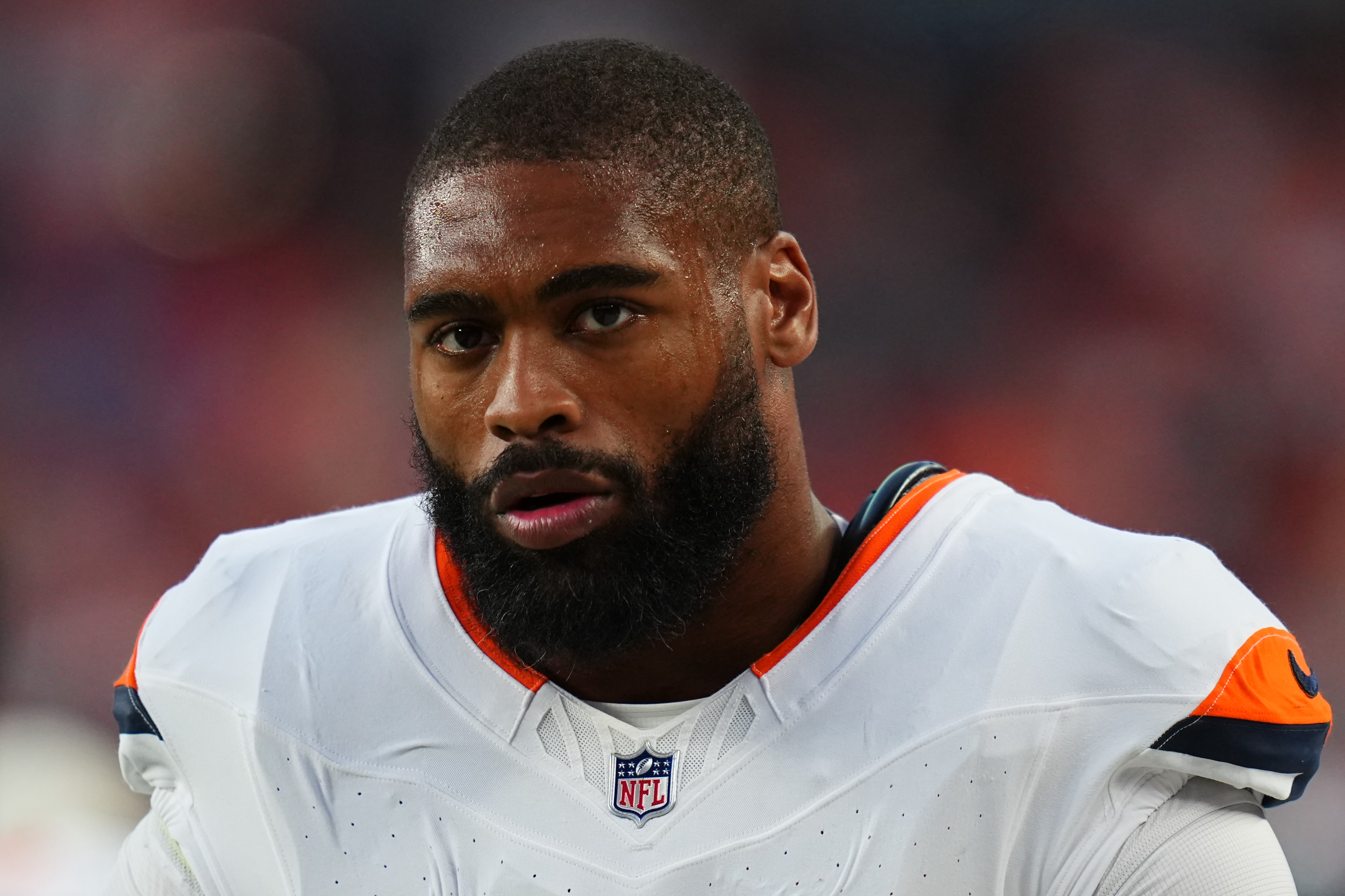 FILE - Denver Broncos linebacker Jonathon Cooper looks on during a preseason NFL football game against the Minnesota Vikings, Aug. 28, 2026, in Denver. 