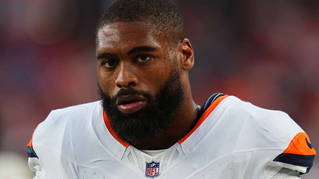 FILE - Denver Broncos linebacker Jonathon Cooper looks on during a preseason NFL football game against the Minnesota Vikings, Aug. 28, 2026, in Denver.