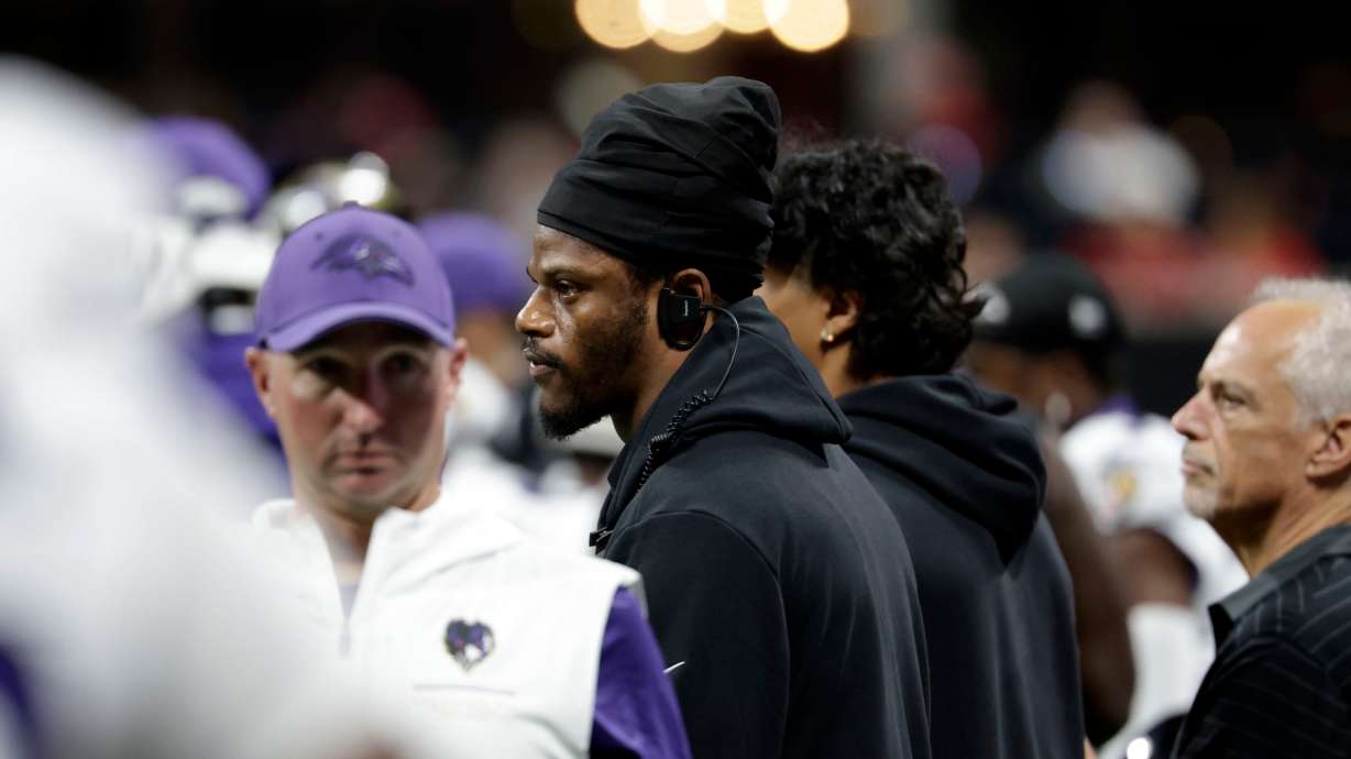 Injured Baltimore Ravens quarterback Lamar Jackson watches from the sideline during the first half of an NFL football game against the Atlanta Falcons, Sunday, Oct. 11, 2026, in Atlanta.