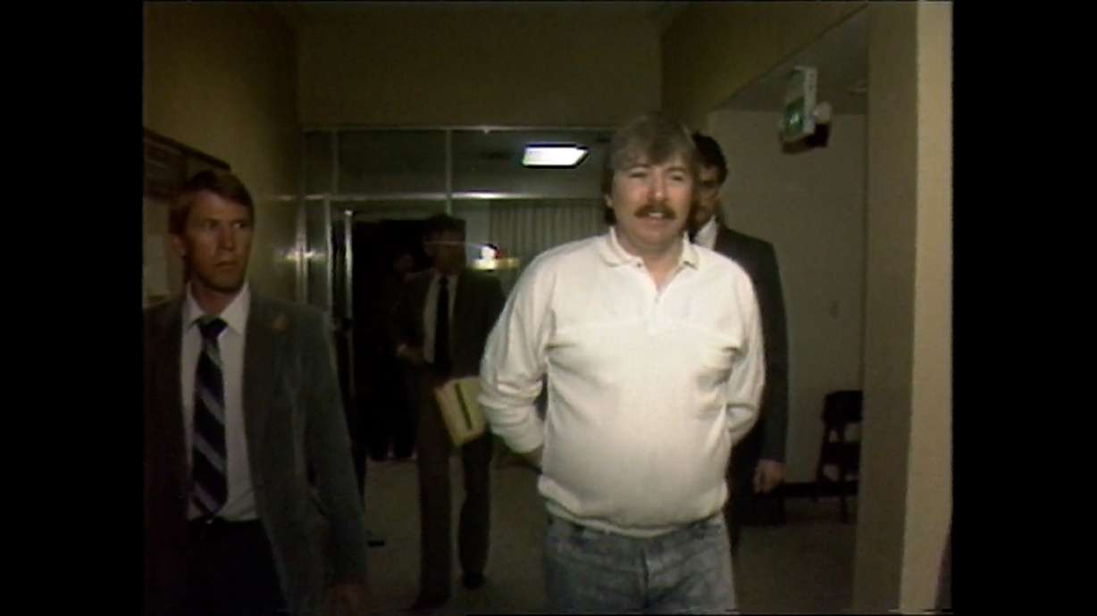 Thomas Randolph walks through the courthouse hallways in KSL archive footage from the 1980s.