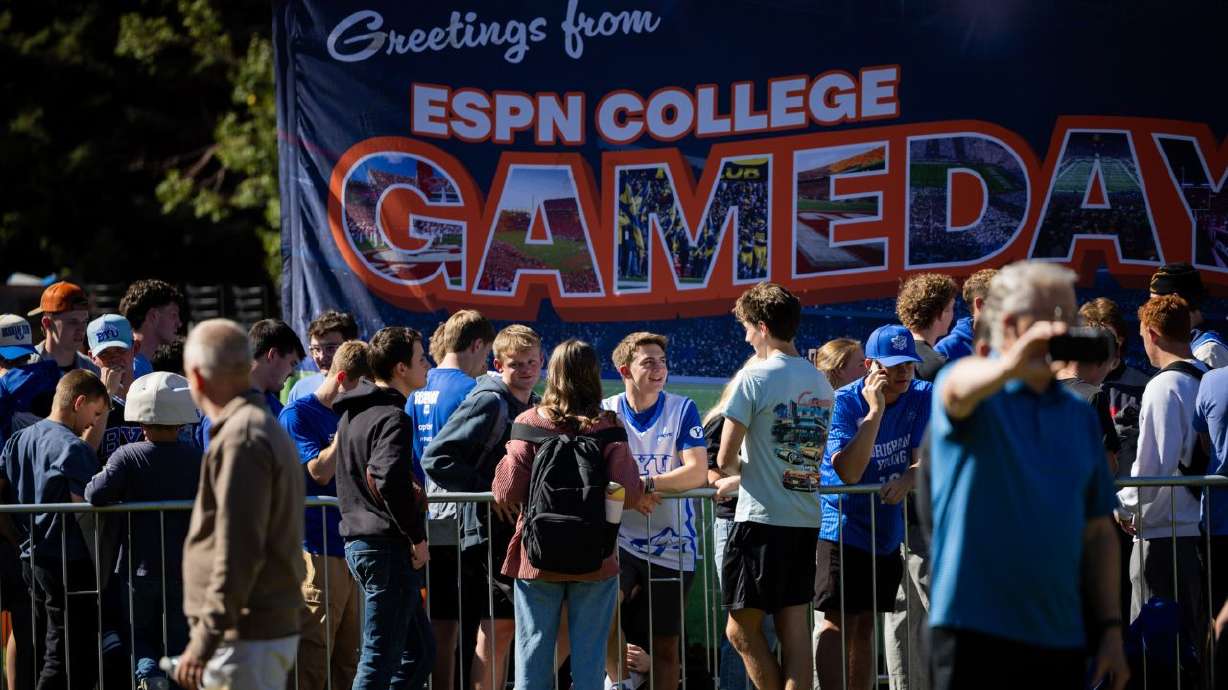 BYU students wait in line for a spot to watch ESPN’s “College GameDay” on the lawn at Heritage Halls on BYU campus in Provo on Friday. Irish fans exploring Provo's Center Street Friday afternoon said they had traveled from places like Connecticut, Ohio and California to catch the big game.