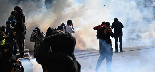 Clashes and fires break out as protesters rally across France, joining students