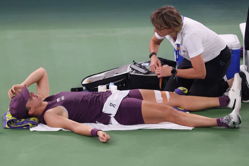 Tennis-Injured Swiatek goes down fighting in Wuhan Open semi-final