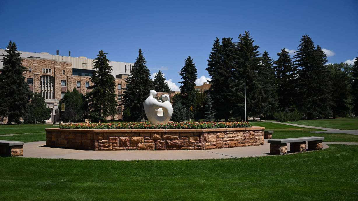 The University Family statue stands on the University of Wyoming campus in Laramie, Wyoming, in 2022.