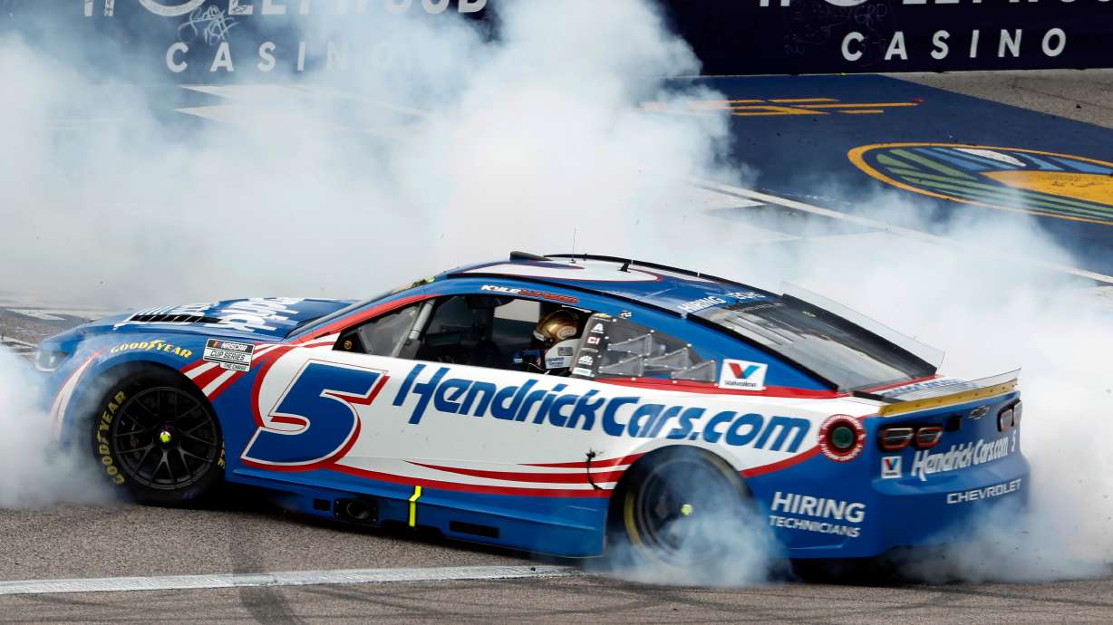 Kyle Larson does a burnout after winning a NASCAR Cup Series auto race in Kansas City, Kan., Sunday, Sept. 27, 2026.