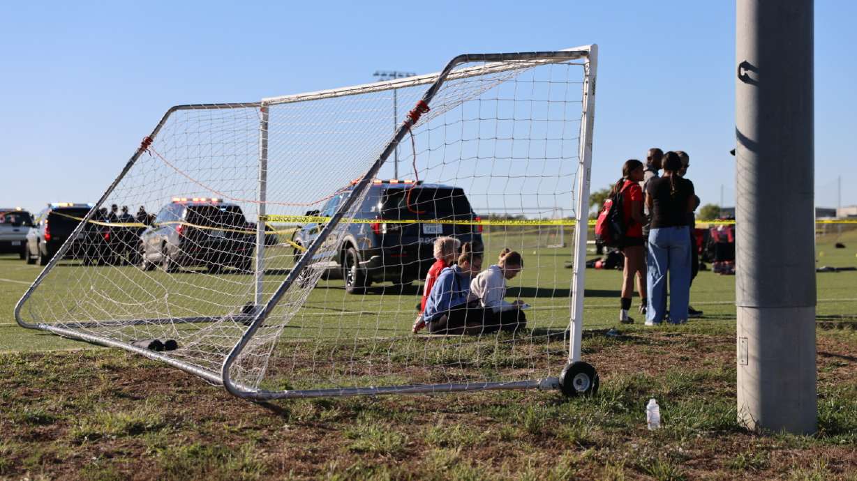 Police on the scene where a person drove a vehicle through a soccer field during a game in Wichita, Kansas, Saturday. Two people and 11 other victims were taken to the hospital, authorities said.