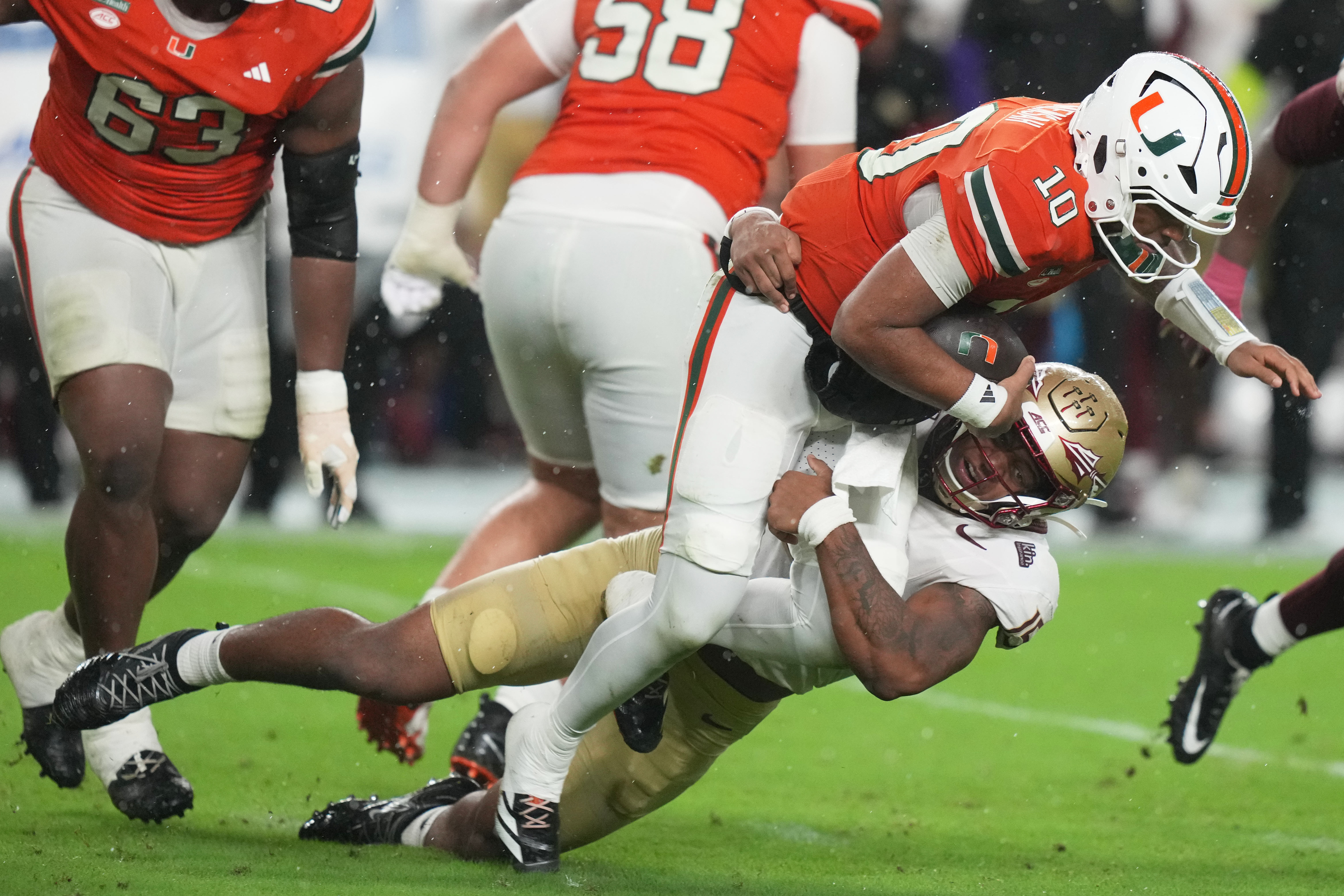 Florida State defensive lineman Rylan Kennedy sacks Miami quarterback Darian Mensah (10) during the first half of an NCAA college football game, Saturday, Oct. 17, 2026, in Miami Gardens, Fla. 