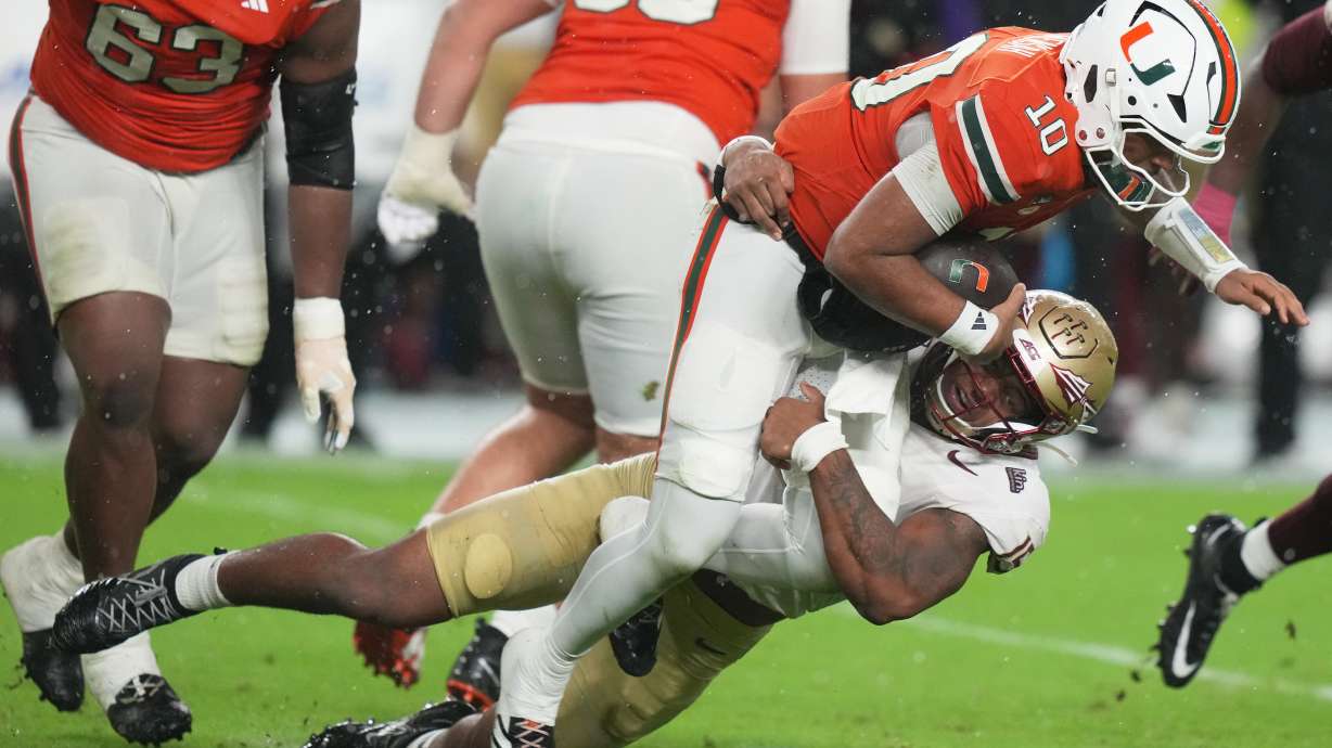 Florida State defensive lineman Rylan Kennedy sacks Miami quarterback Darian Mensah (10) during the first half of an NCAA college football game, Saturday, Oct. 17, 2026, in Miami Gardens, Fla.