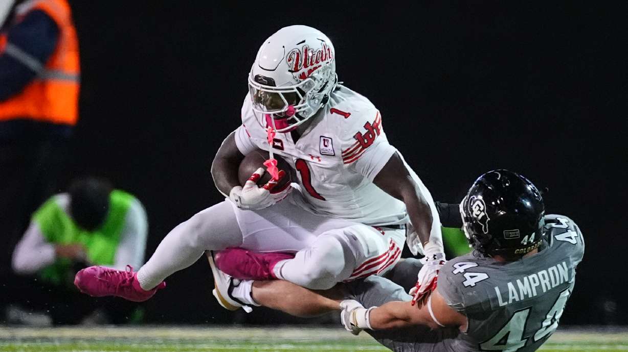 Utah running back Wayshawn Parker, left, is stopped after a short gain by Colorado linebacker Gideon Lampron in the first half of an NCAA college football game Saturday, Oct. 17 2026, in Boulder, Colo.
