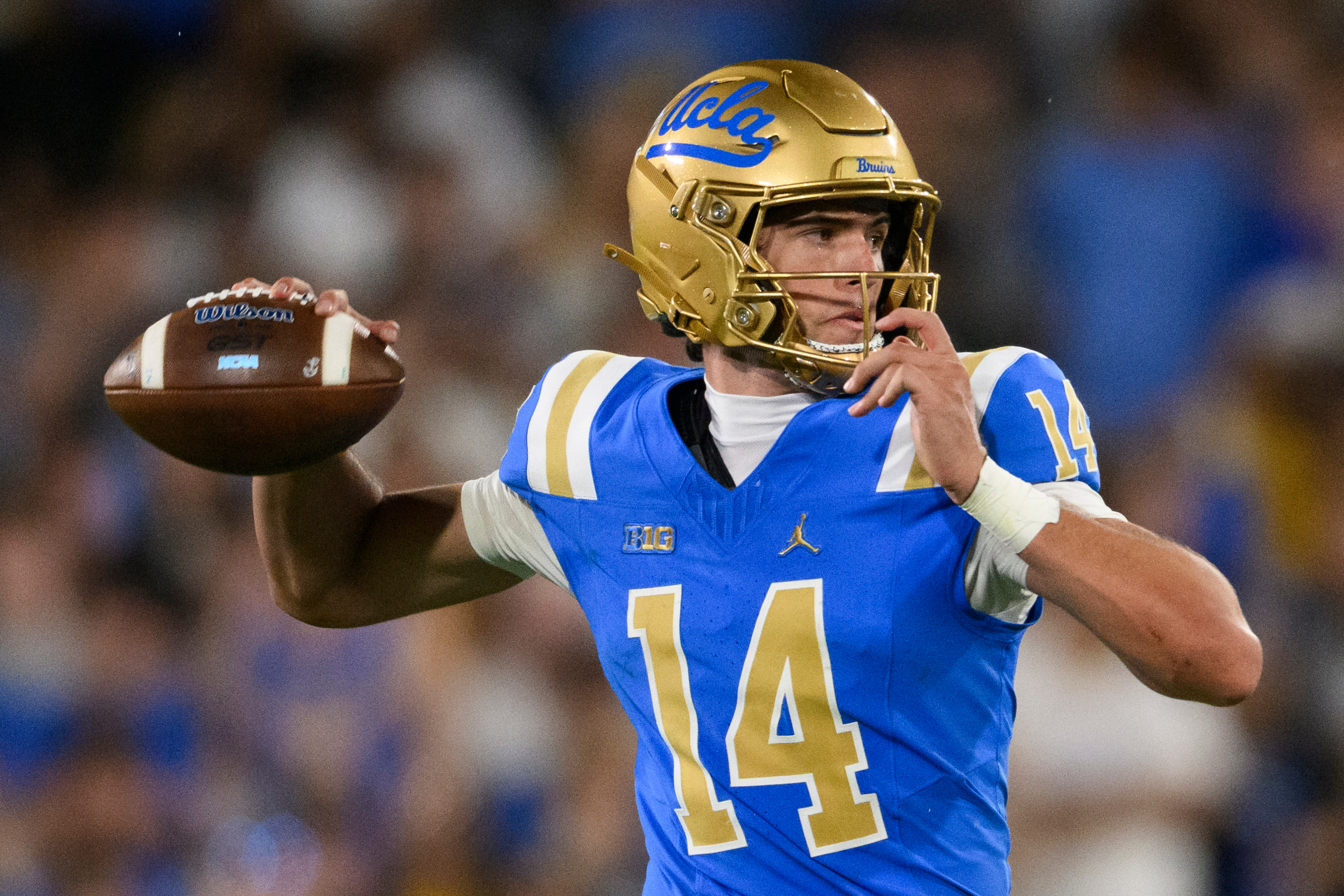 UCLA quarterback Ty Dieffenbach (14) throws a pass during the second half of an NCAA college football game against Wisconsin Saturday, Oct. 17, 2026, in Pasadena, Calif. 