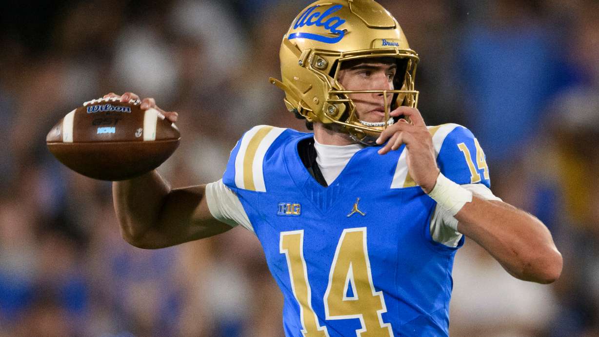 UCLA quarterback Ty Dieffenbach (14) throws a pass during the second half of an NCAA college football game against Wisconsin Saturday, Oct. 17, 2026, in Pasadena, Calif.