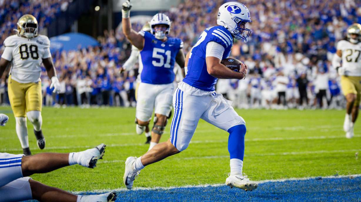 BYU Cougars quarterback Bear Bachmeier (47) scores a touchdown during a football game against the Notre Dame Fighting Irish at LaVell Edwards Stadium in Provo on Saturday, Oct. 17, 2026.