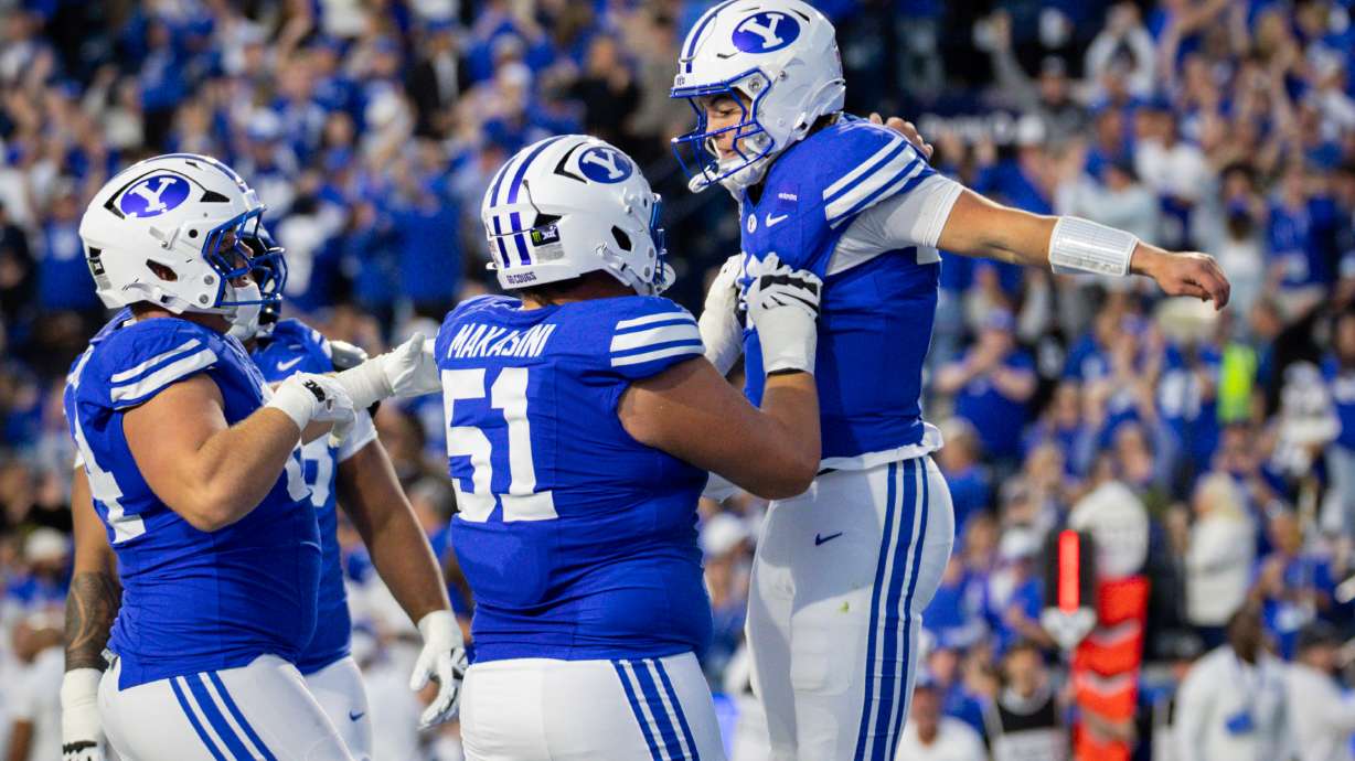 BYU Cougars quarterback Bear Bachmeier (47), right, celebrates after scoring a touchdown during a football game against the Notre Dame Fighting Irish at LaVell Edwards Stadium in Provo on Saturday, Oct. 17, 2026.