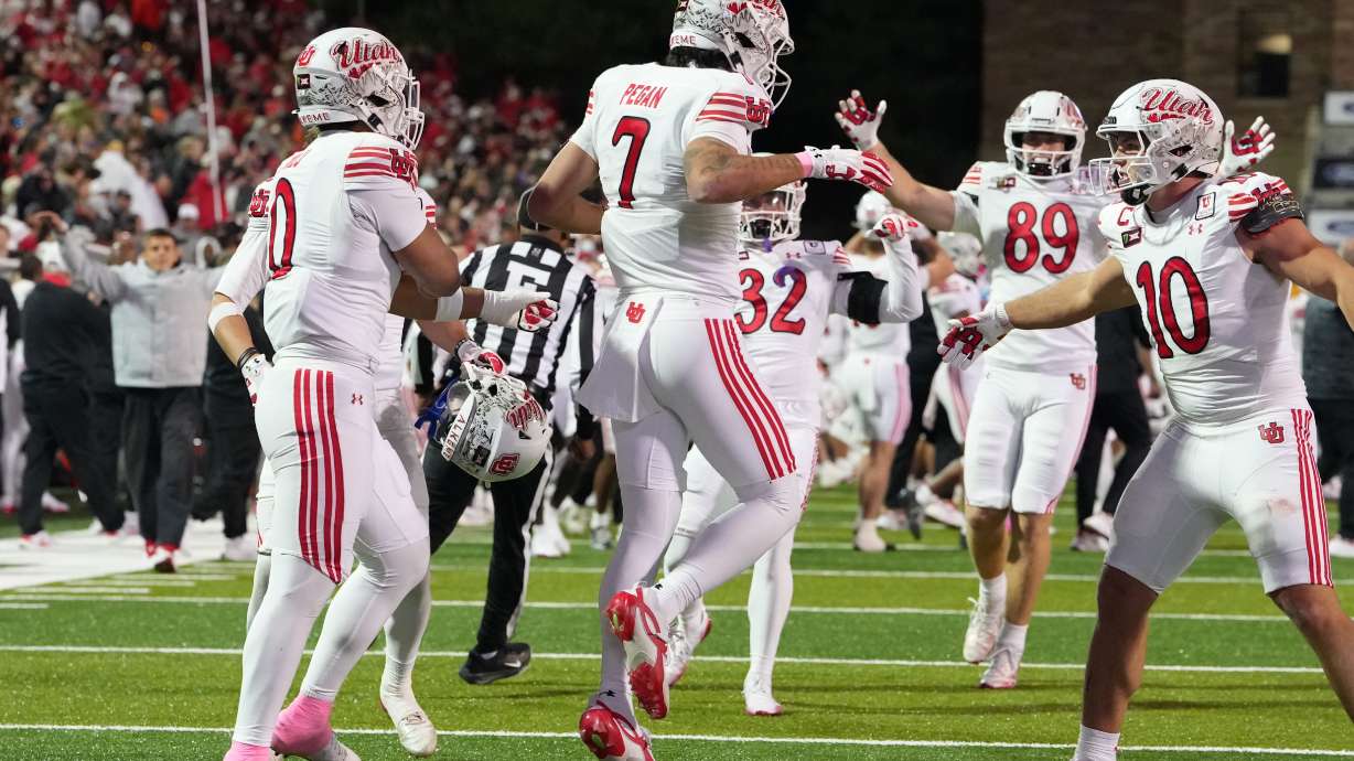 Utah defender Braden Pegan, center, is congratulated after stopping a last-second touchdown pass by linebacker Cyrus Polu, left, and tight end Hunter Andrews to end the second half of an NCAA college football game against Colorado Saturday, Oct. 17 2026, in Boulder, Colo.