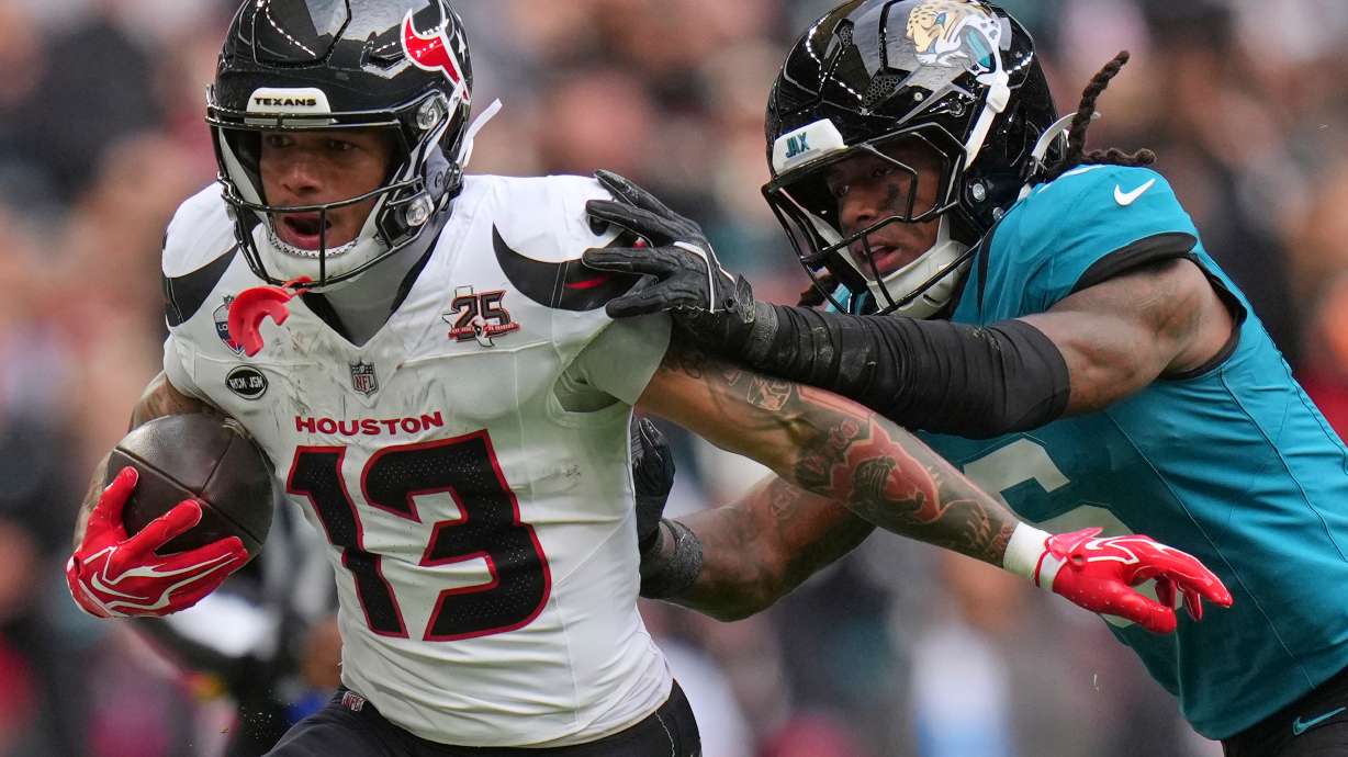 Houston Texans wide receiver Jaylin Noel (13) is challenged by Jacksonville Jaguars safety Antonio Johnson (6) during an NFL football game in London, Sunday, Oct. 18, 2026.