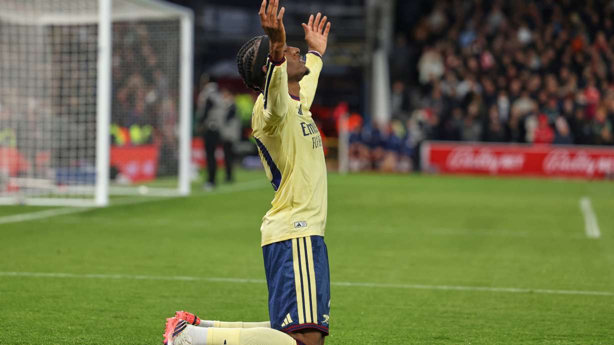 Arsenal's Noni Madueke celebrates after scoring his side's opening goal during the English Premier League soccer match between Nottingham Forest and Arsenal in Nottingham, England, Sunday, Oct. 18, 2026.