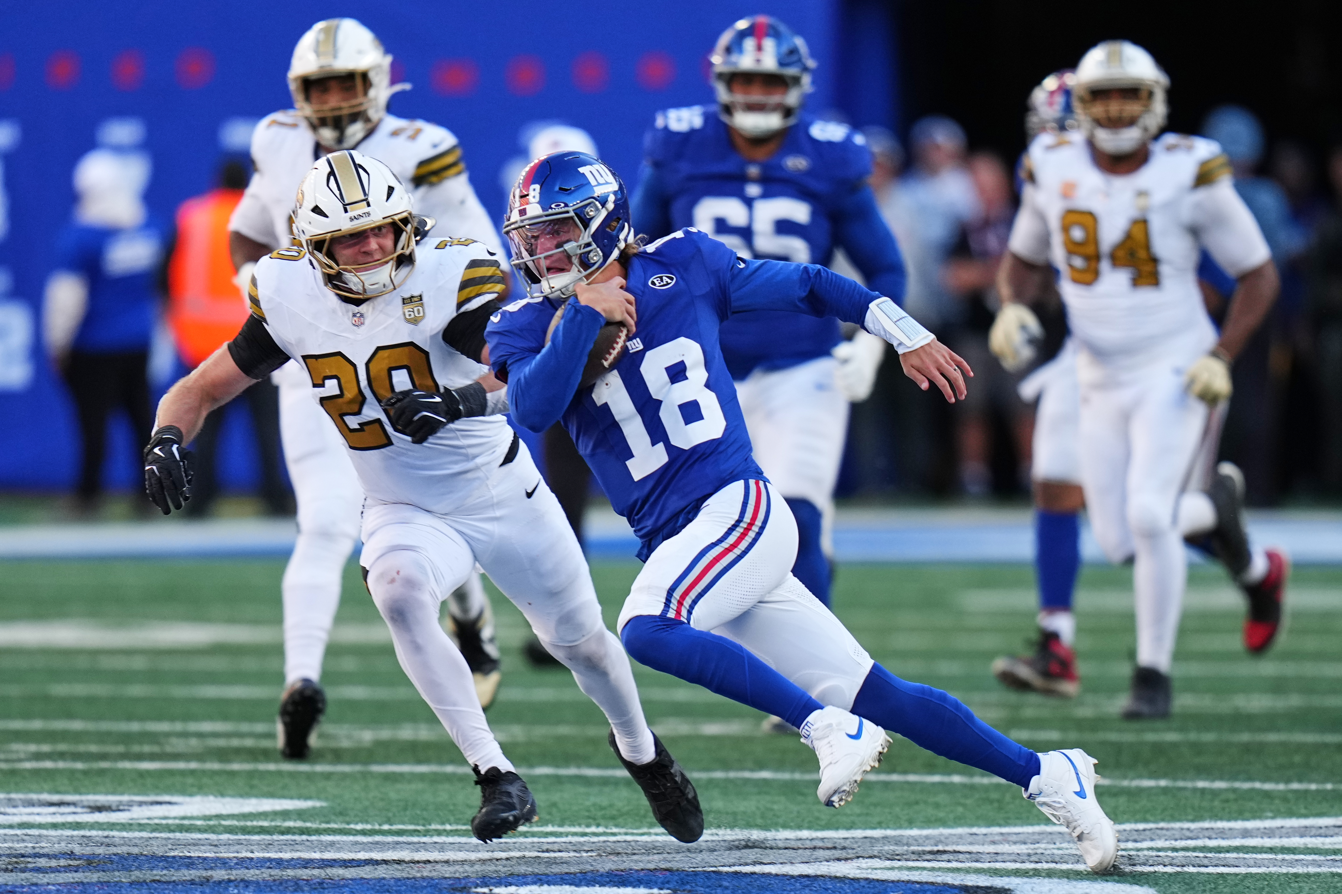 New York Giants quarterback J.J. McCarthy (18) runs the ball during the second half of an NFL football game against the New Orleans Saints in East Rutherford, N.J., Sunday, Oct. 18, 2026. 