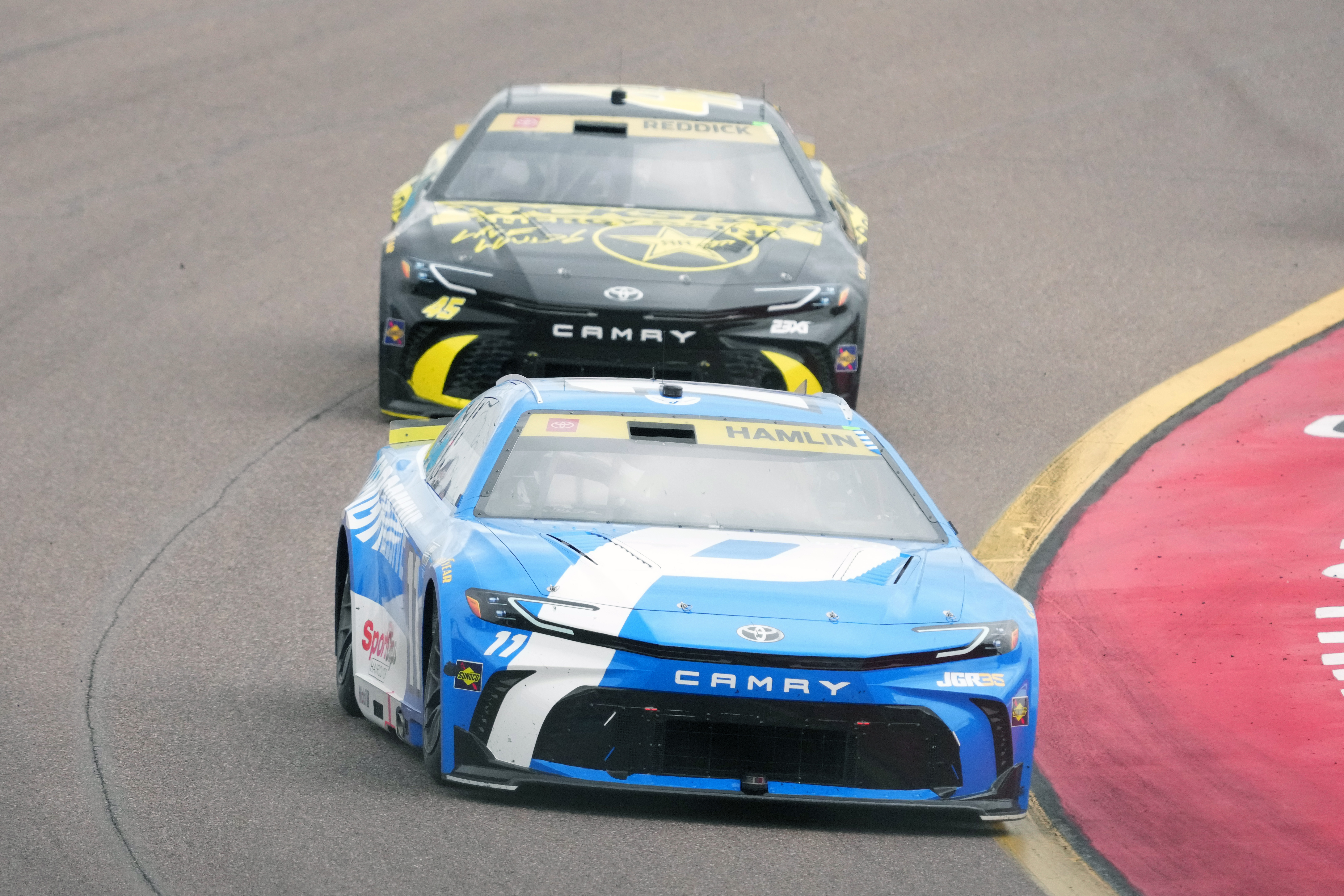 Denny Hamlin (11) leads Tyler Reddick on the 30th lap during a NASCAR Cup Series auto race Sunday, Oct. 18, 2026, in Avondale, Ariz. 