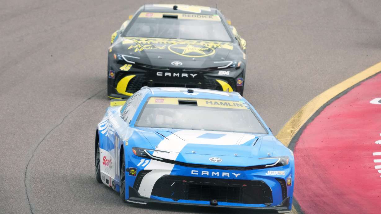 Denny Hamlin (11) leads Tyler Reddick on the 30th lap during a NASCAR Cup Series auto race Sunday, Oct. 18, 2026, in Avondale, Ariz.