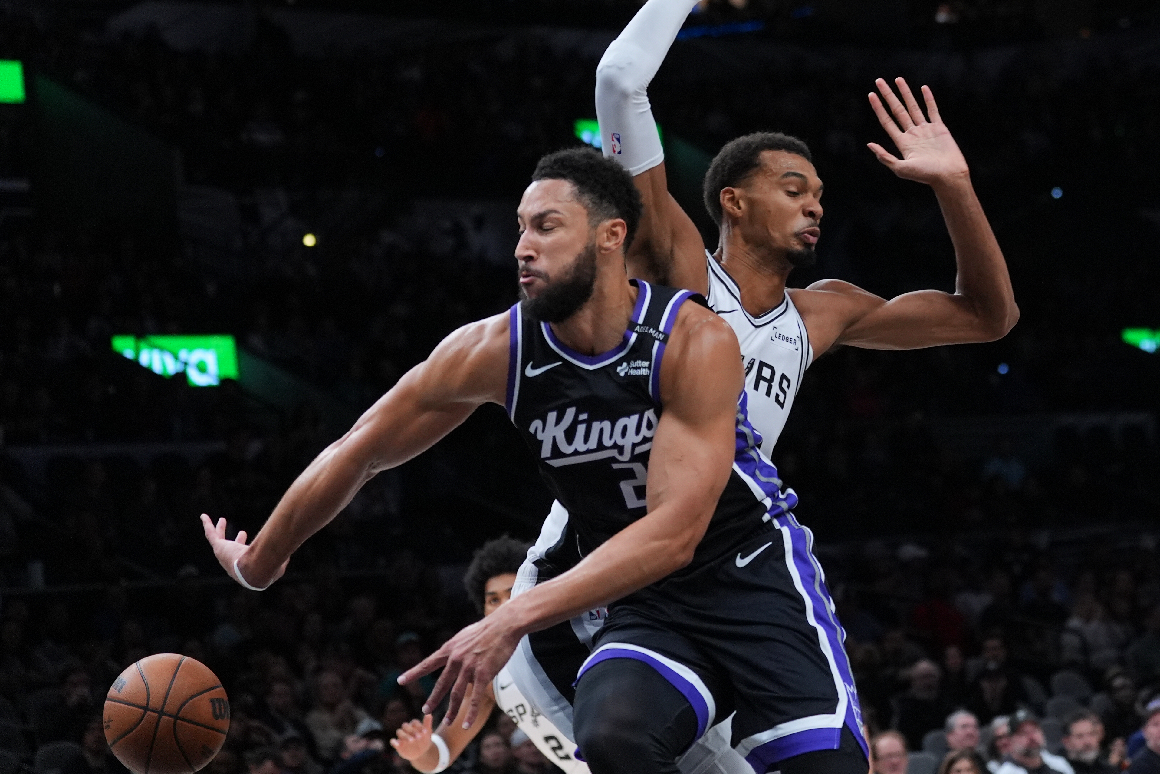 Sacramento Kings guard Ben Simmons (25) drives around San Antonio Spurs forward Victor Wembanyama (1) during the first half of a preseason NBA basketball game in San Antonio, Friday, Oct. 16, 2026. 