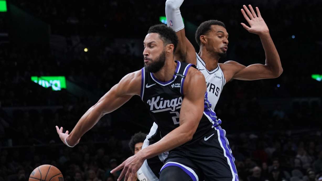 Sacramento Kings guard Ben Simmons (25) drives around San Antonio Spurs forward Victor Wembanyama (1) during the first half of a preseason NBA basketball game in San Antonio, Friday, Oct. 16, 2026.