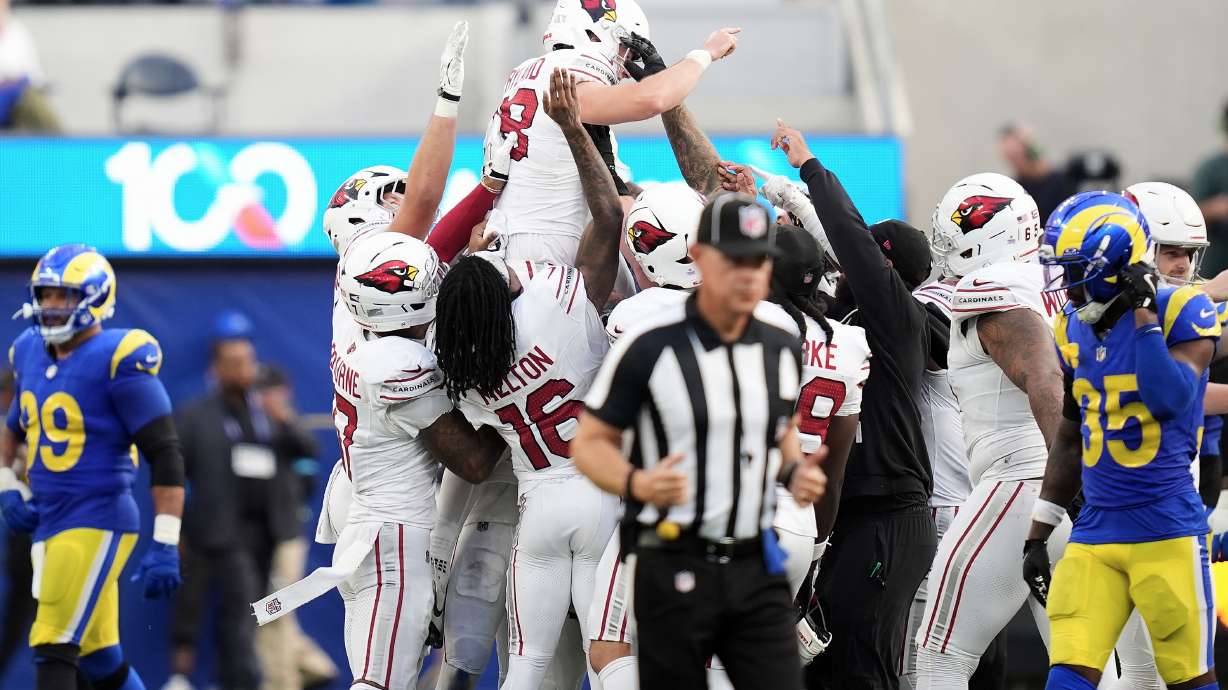 Arizona Cardinals kicker Chad Ryland, top, is congratulated by teammates after kicking the game winning field goal against the Los Angeles Rams during the second half of an NFL football game in Inglewood, Calif., Sunday, Oct. 18, 2026.