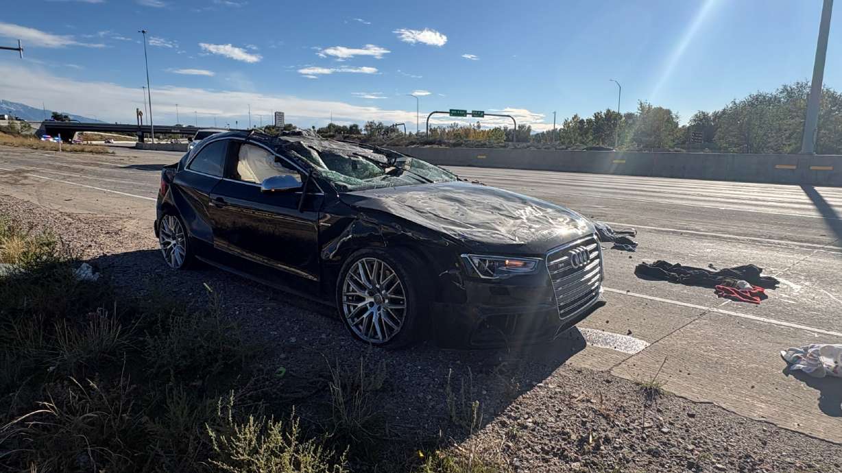 A black Audi is pictured after a three-car crash on northbound I-15 near 600 North in Salt Lake City on Sunday.