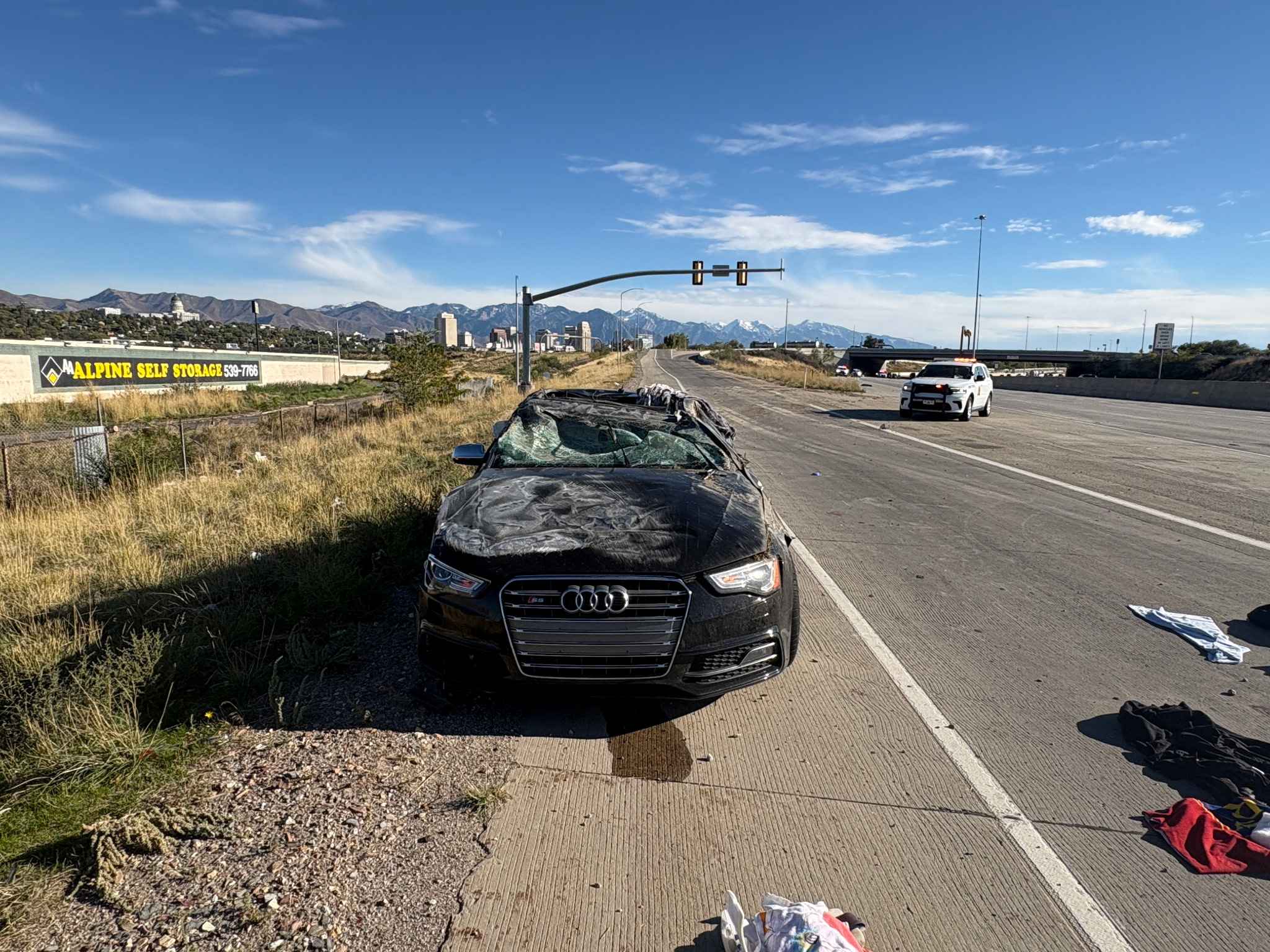 A black Audi is pictured after a three-car crash on northbound I-15 near 600 North in Salt Lake City on Sunday.