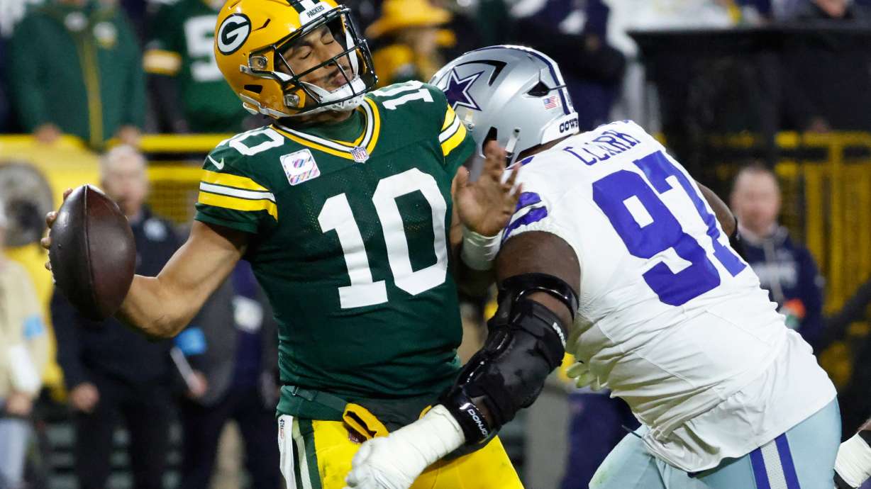 Dallas Cowboys' Kenny Clark sacks Green Bay Packers' Jordan Love during the second half of an NFL football game in Green Bay, Wis., Sunday, Oct. 18, 2026.