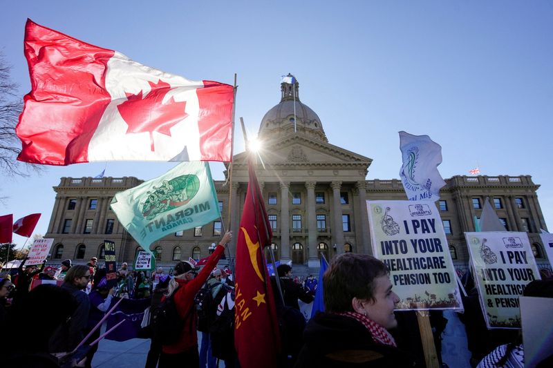 People take part in a Pro-Canada Rally, at the Provincial Legislature ahead of a non-binding referendum on Alberta sovereignty, in Edmonton, Alberta, Canada, Sunday.