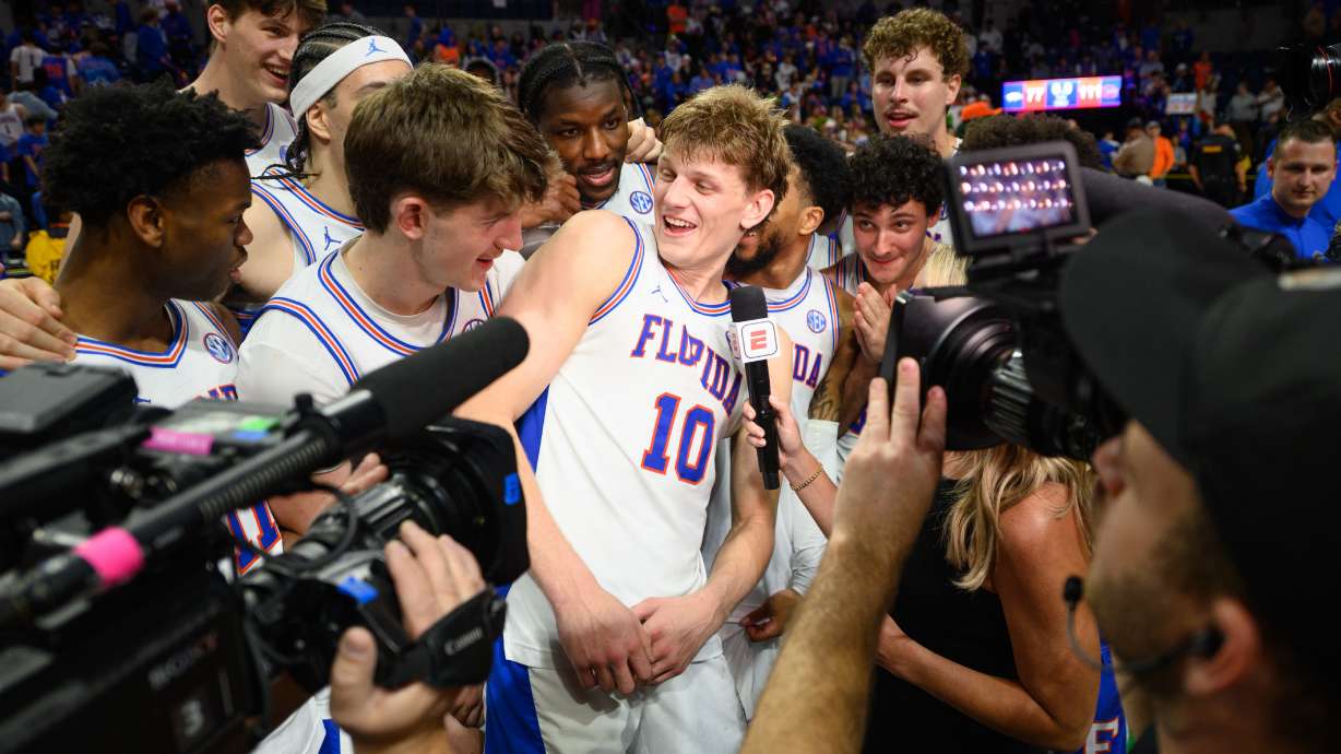 FILE - Florida forward Thomas Haugh (10) gives a post game interview after an NCAA college basketball game against Arkansas, Feb. 28, 2026, in Gainesville, Fla.