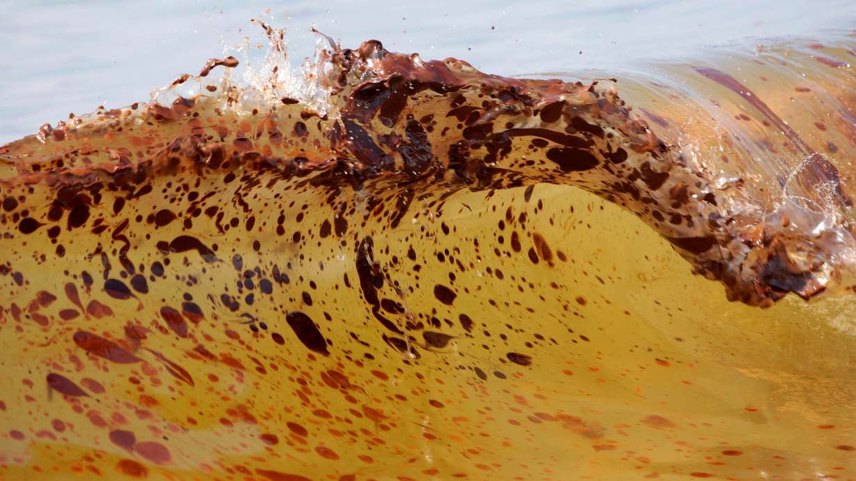 Crude oil from the Deepwater Horizon oil spill washes ashore in Orange Beach, Ala., June 12, 2010.