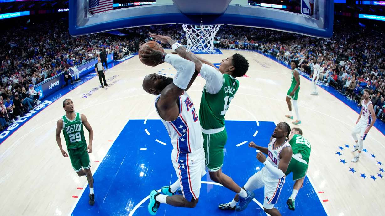 Philadelphia 76ers' LeBron James, left, goes up for a shot against Boston Celtics' Chris Cenac Jr. during the first half of a preseason NBA basketball game Friday, Oct. 16, 2026, in Philadelphia.