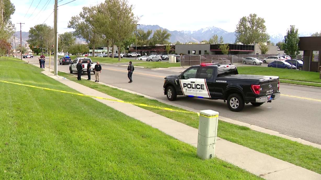 Police at the scene of a shooting in West Valley City on Monday.