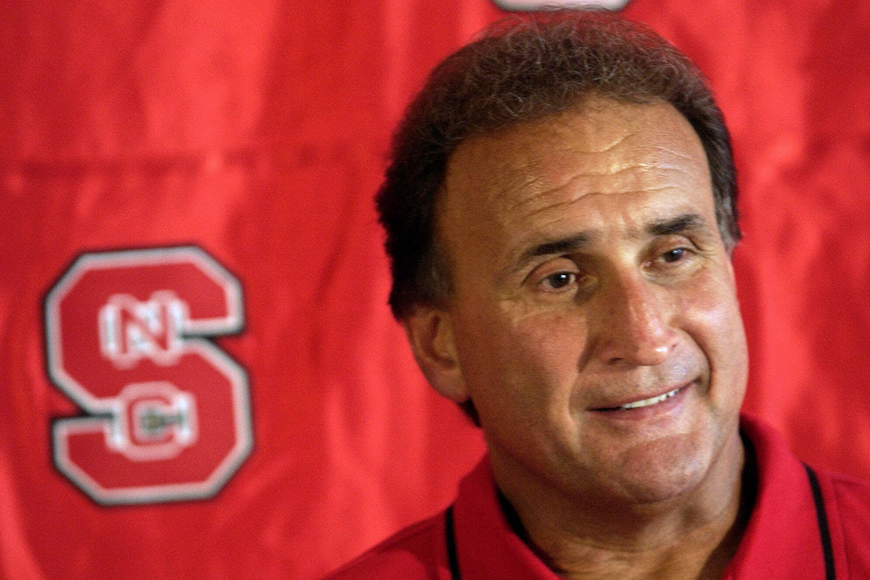 FILE - North Carolina State coach Chuck Amato answers questions from reporters during the team's media day, Aug. 12, 2001, at Carter-Finley Stadium in Raleigh, N.C. 