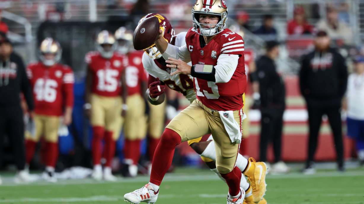 San Francisco 49ers quarterback Brock Purdy (13) scrambles while pressured against the Washington Commanders during the first half of an NFL football game in Santa Clara, Calif., Monday, Oct. 19, 2026.