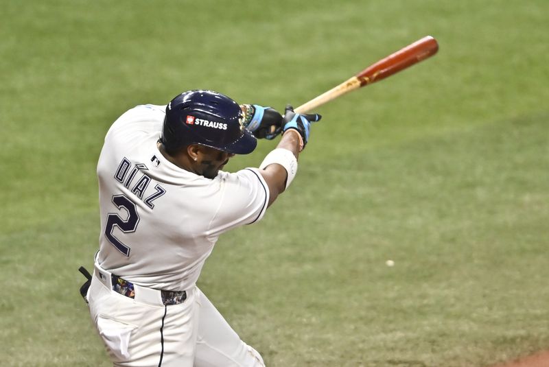 Oct 19, 2026; St. Petersburg, Florida, USA;  Tampa Bay Rays designated hitter Yandy Diaz (2) hits a two run home run during the eighth inning against the Cleveland Guardians in game six of the ALCS for the 2026 MLB Playoffs at Tropicana Field.