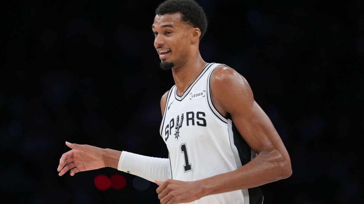 San Antonio Spurs forward Victor Wembanyama (1) reacts to a play during the second half of a preseason NBA basketball game against the Phoenix Suns in San Antonio, Wednesday, Oct. 14, 2026.