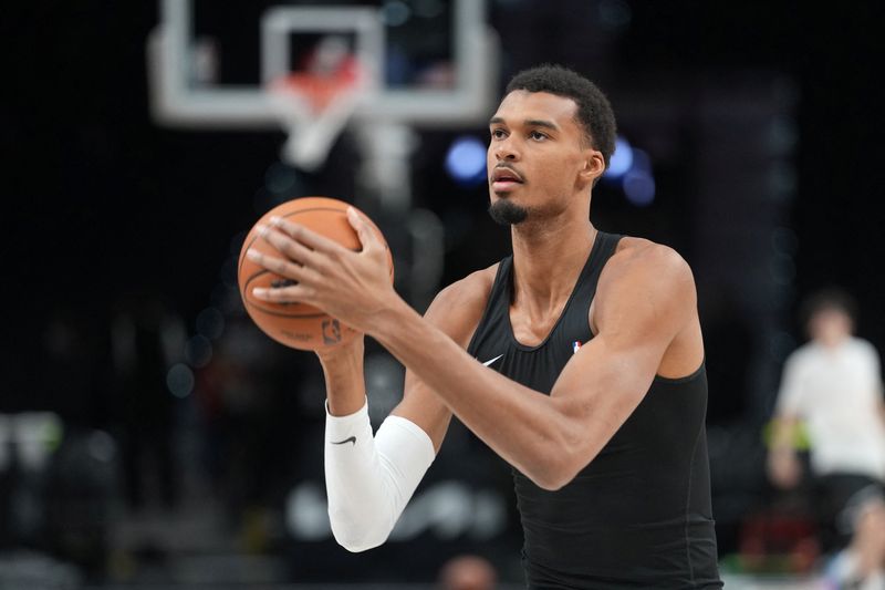 FILE PHOTO: Oct 16, 2026; San Antonio, Texas, USA;  San Antonio Spurs forward Victor Wembanyama (1) warms up before a game against the Sacramento Kings at Frost Bank Center.