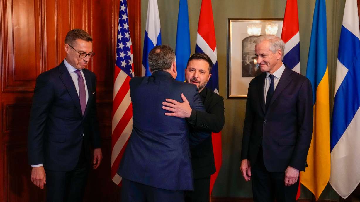 Ukrainian President Volodymyr Zelenskyy hugs special envoy Steve Witkoff as Norwegian Prime Minister Jonas Gahr Støre and Finnish President Alexander Stubb look on, in Oslo, Norway, Tuesday. Zelenskyy said Kyiv was again receiving early warnings from its partners on Russian attacks.