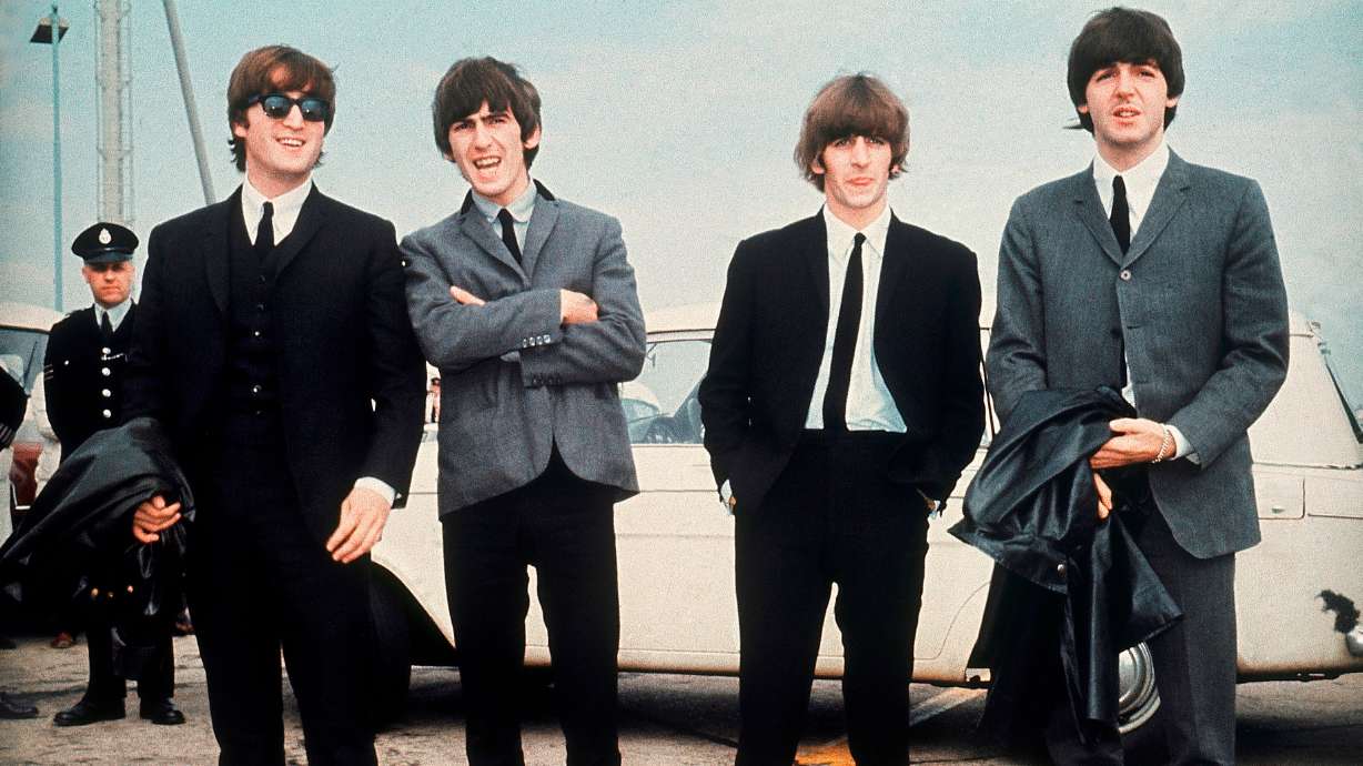 The Beatles; John Lennon, George Harrison, Ringo Starr and Paul McCartney, arrive in Liverpool, England, on July 10, 1964, for the premiere of their movie "A Hard Day's Night." Liverpool announced plans for a new attraction on the Beatles on Tuesday.