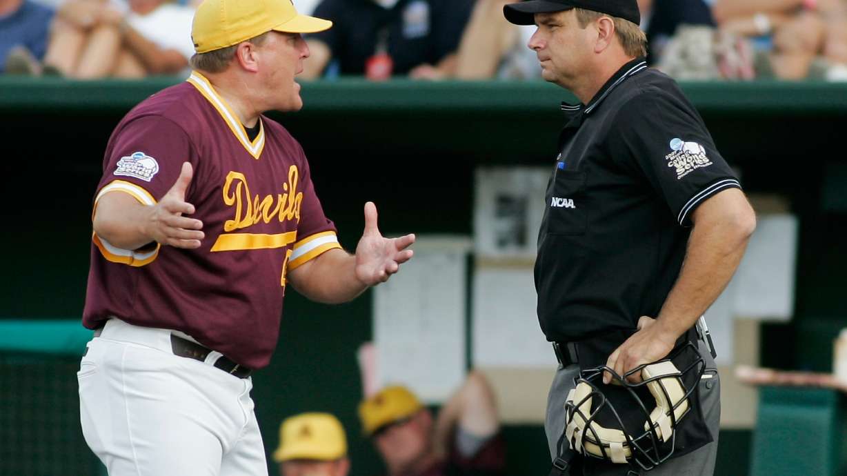FILE - Arizona State coach Pat Murphy, left, protests to home plate umpire Jeff Henrichs after a balk call allowed UC Irvine's Taylor Holiday to score in the fourth inning of a College World Series baseball elimination game in Omaha, Neb., June 19, 2007.